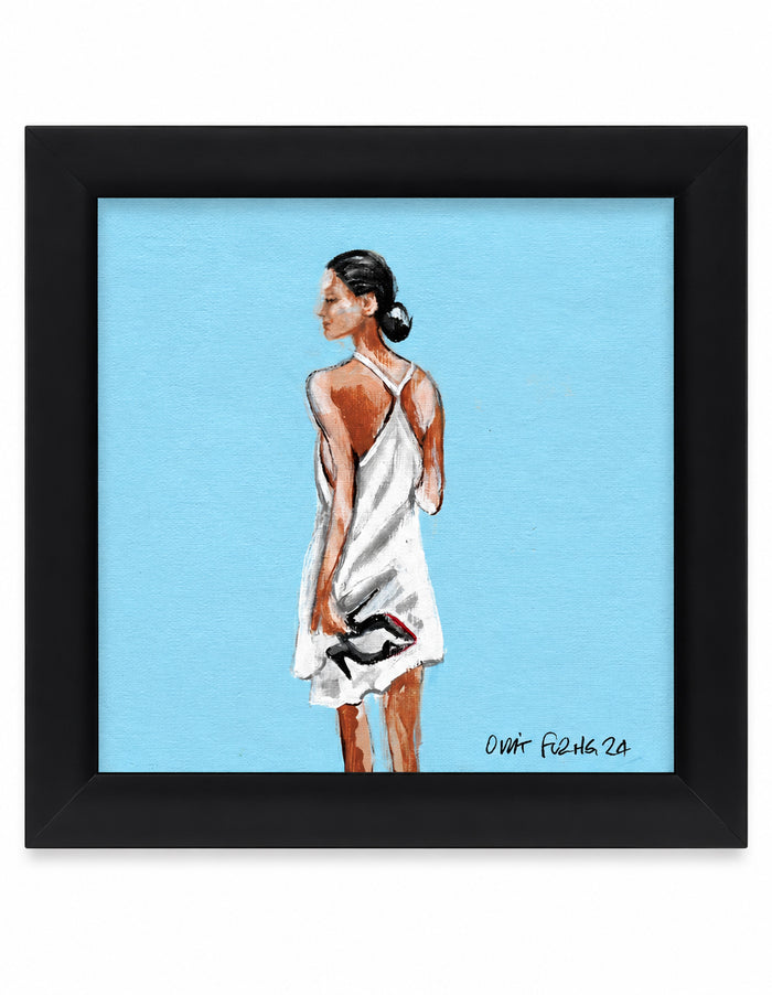 Framed art print featuring a original painting by Orit Fuchs of a woman in a white dress seen from behind, set against a light blue background with a black frame.